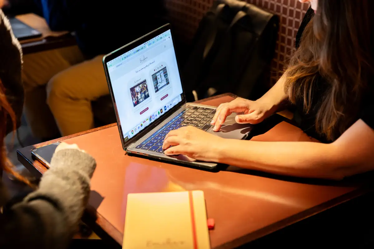 Woman typing on a laptop